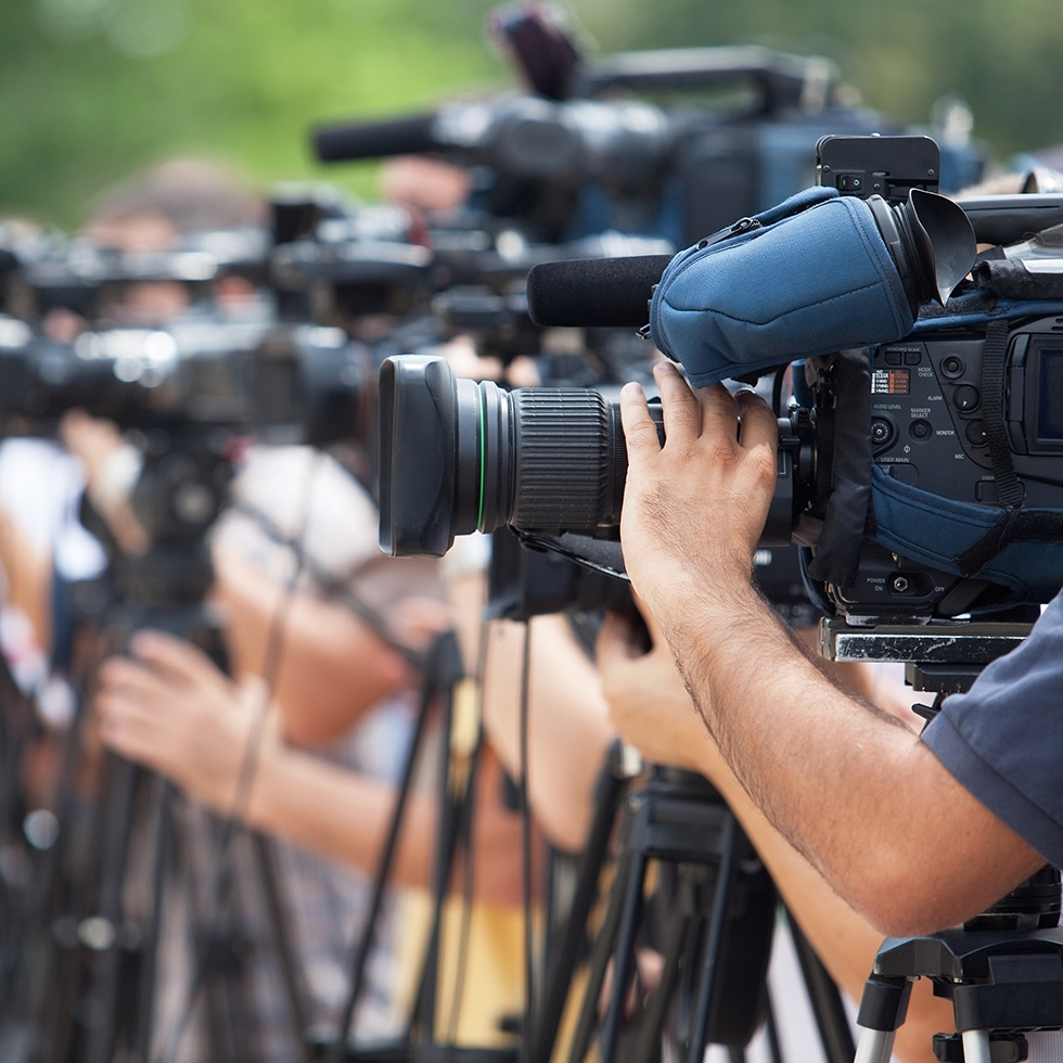 News,Conference.,Filming,An,Event,With,A,Video,Camera.